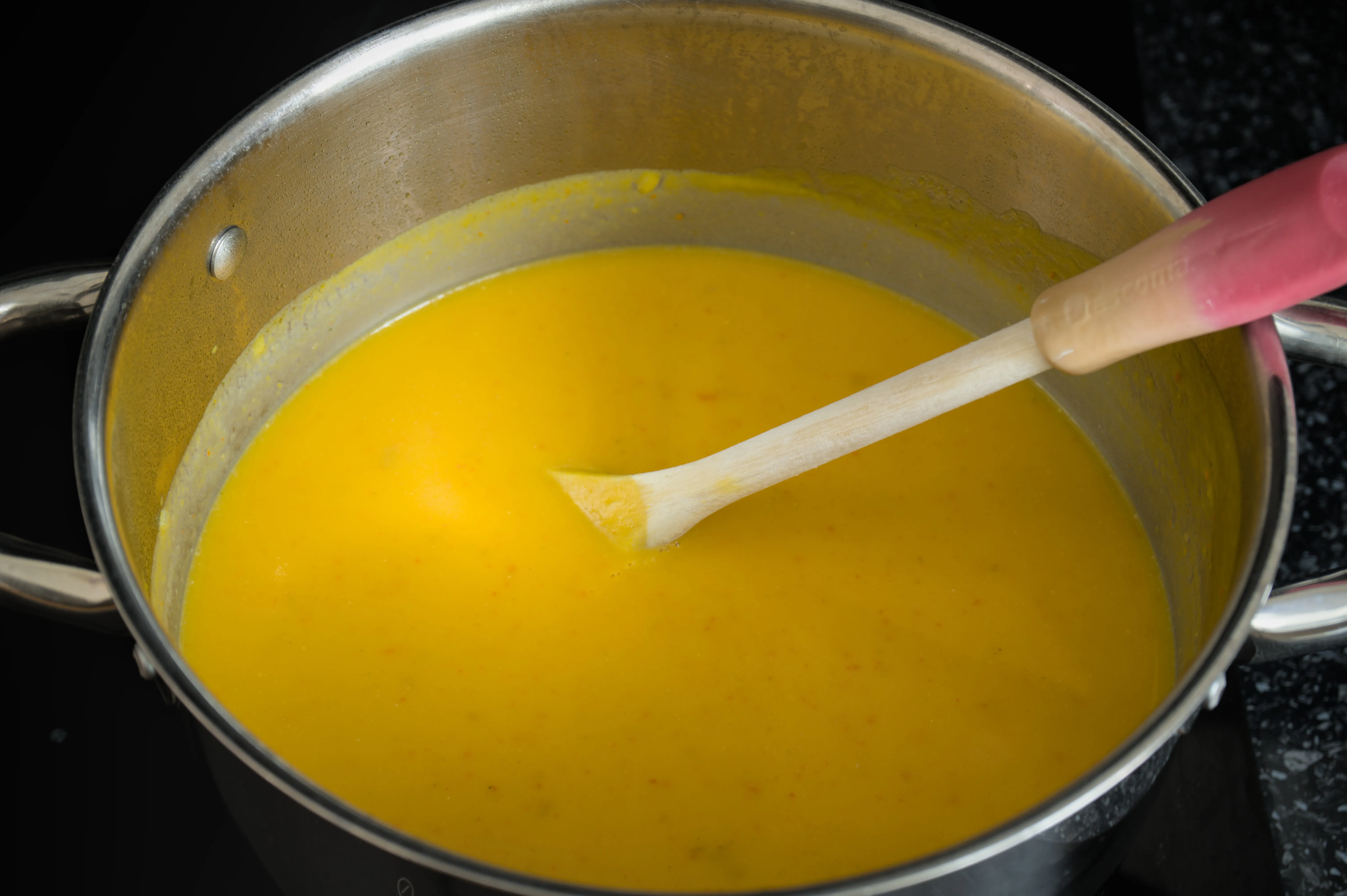 Smooth blended Hokkaido pumpkin soup in a pot