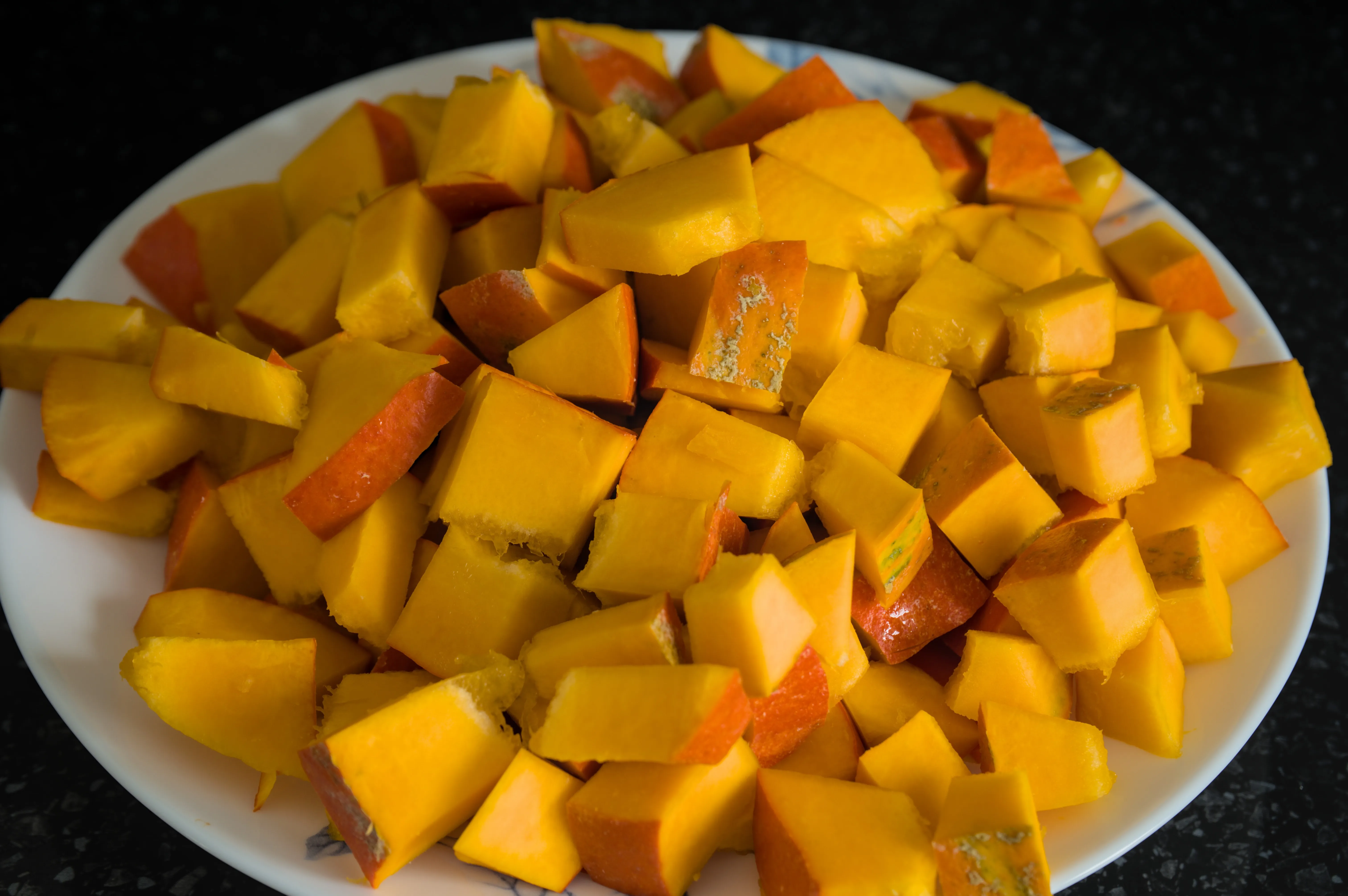 Hokkaido pumpkin cut into small cubes with its skin on