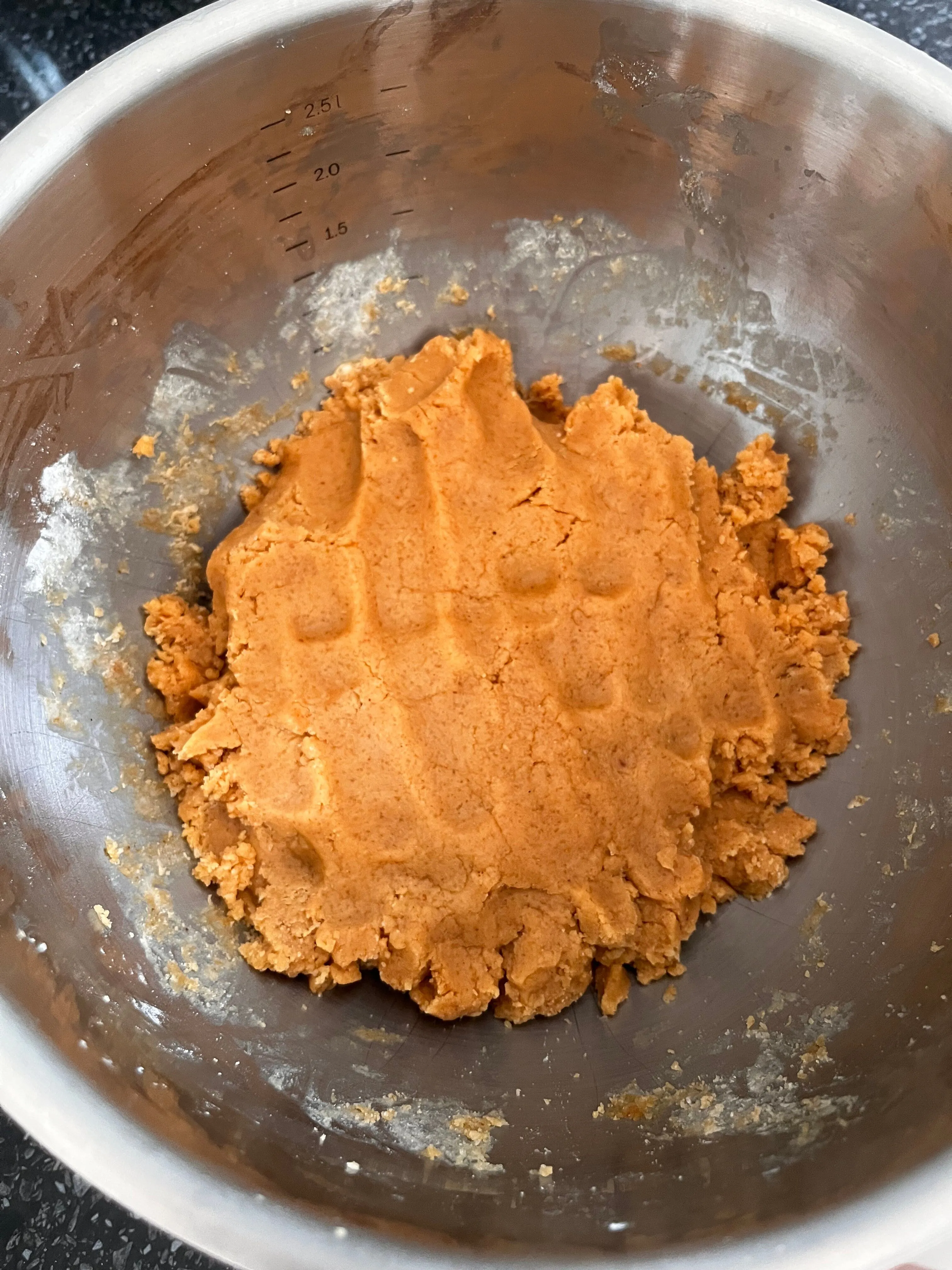 Finished peanut butter cookie dough in a mixing bowl