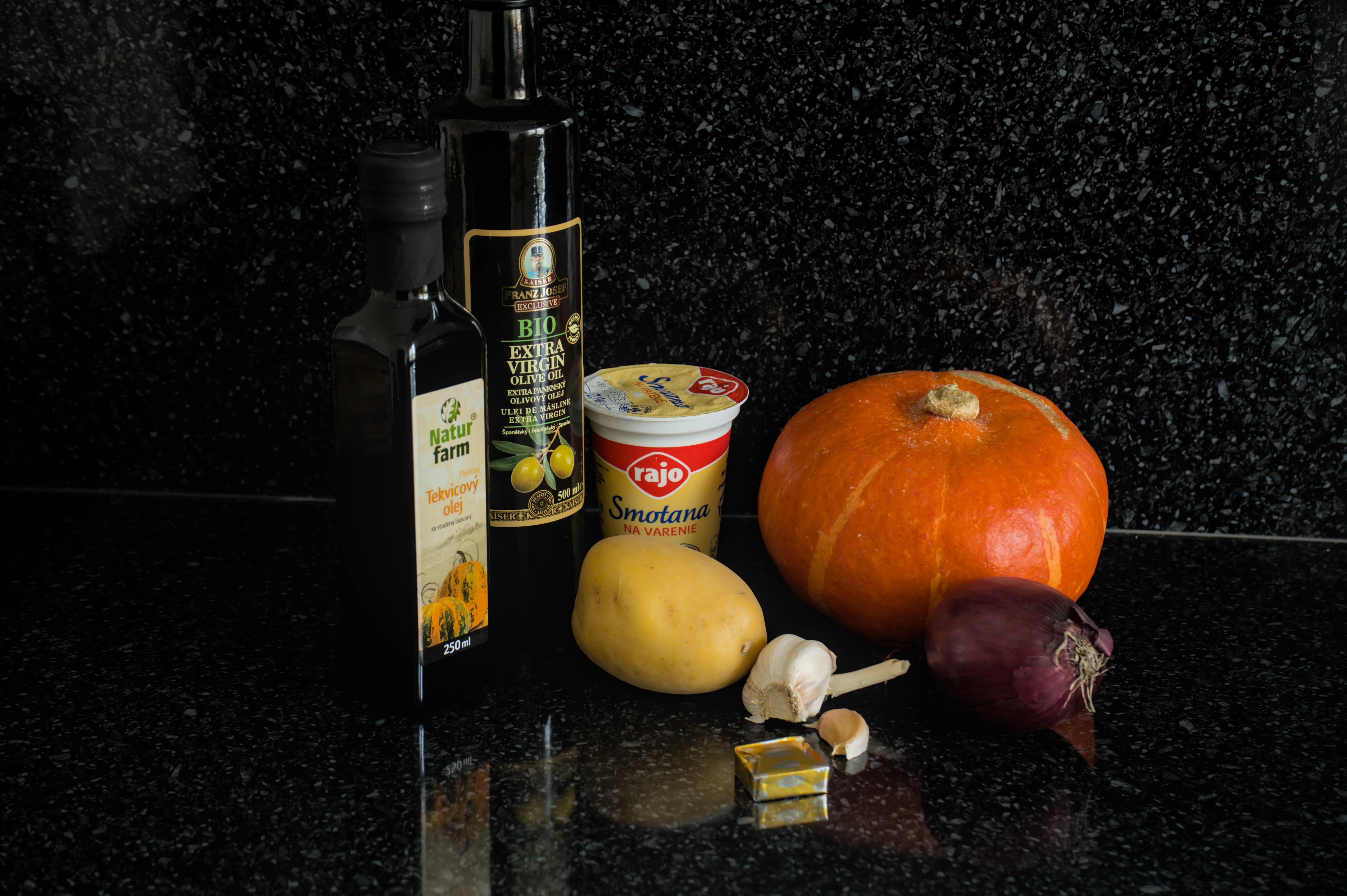 Hokkaido pumpkin, potato, red onion, garlic, cooking cream, olive oil and pumpkin seed oil prepared for pumpkin soup