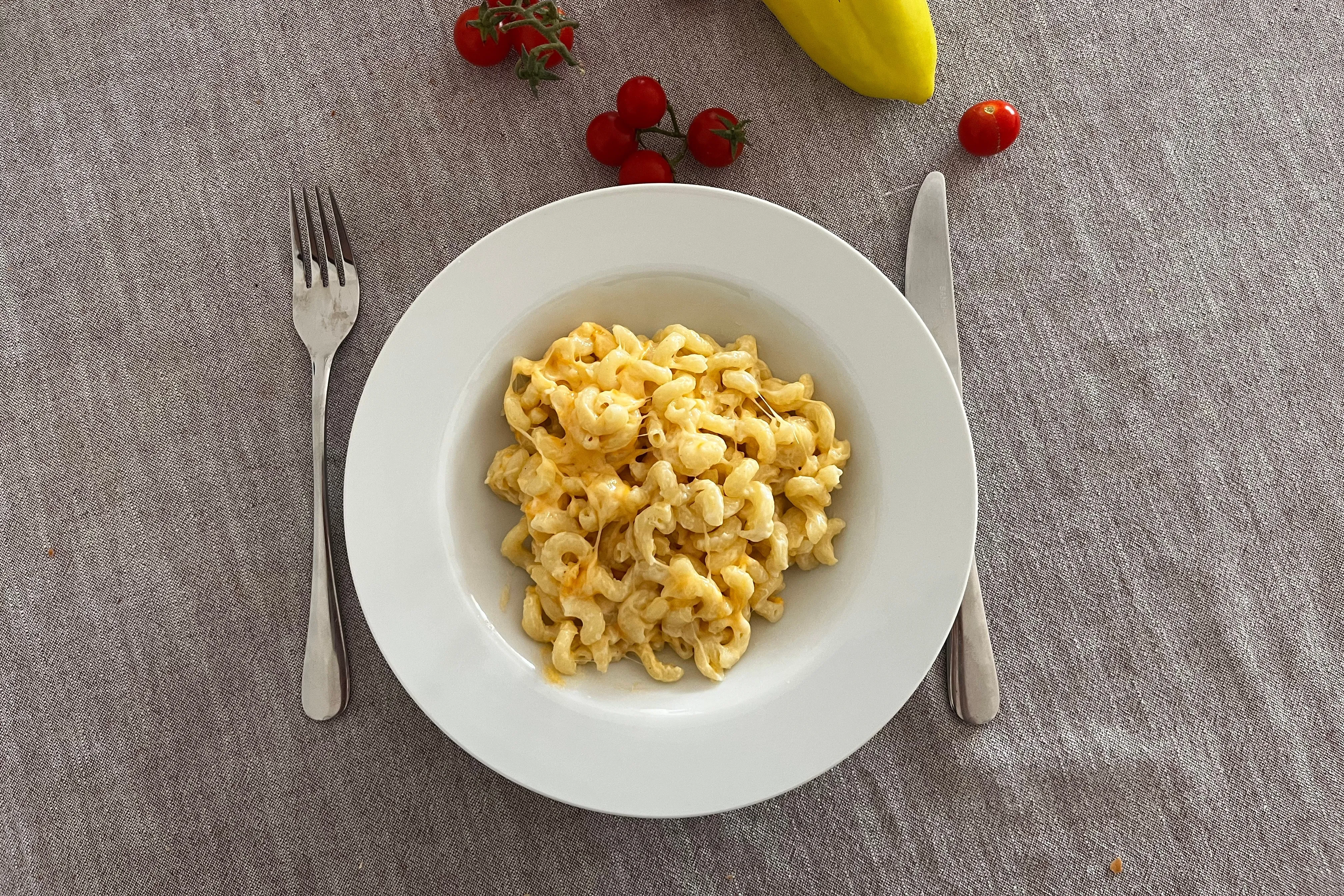 Creamy three-cheese macaroni on a white plate